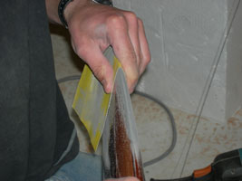 V-5-11 sandpaper around lea